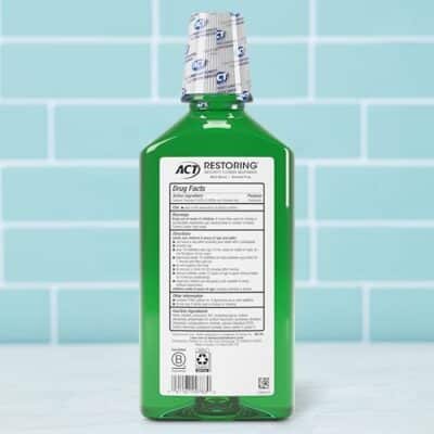 ACT Restoring Zero Alcohol Fluoride Mouthwash 33.8 fl. oz. Strengthens Tooth Enamel, Mint Burst - Image 2